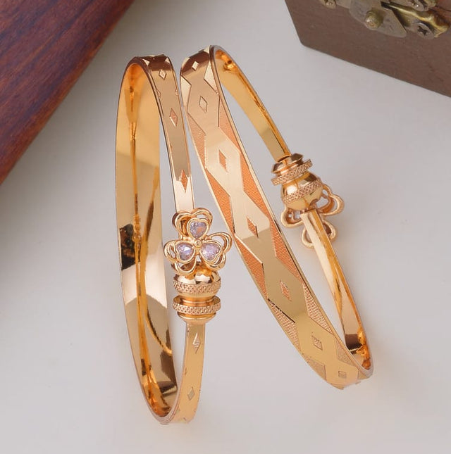 Diamond-Cut Pattern Gold Bangles with Floral Centerpiece – Elegant Ethnic Wear