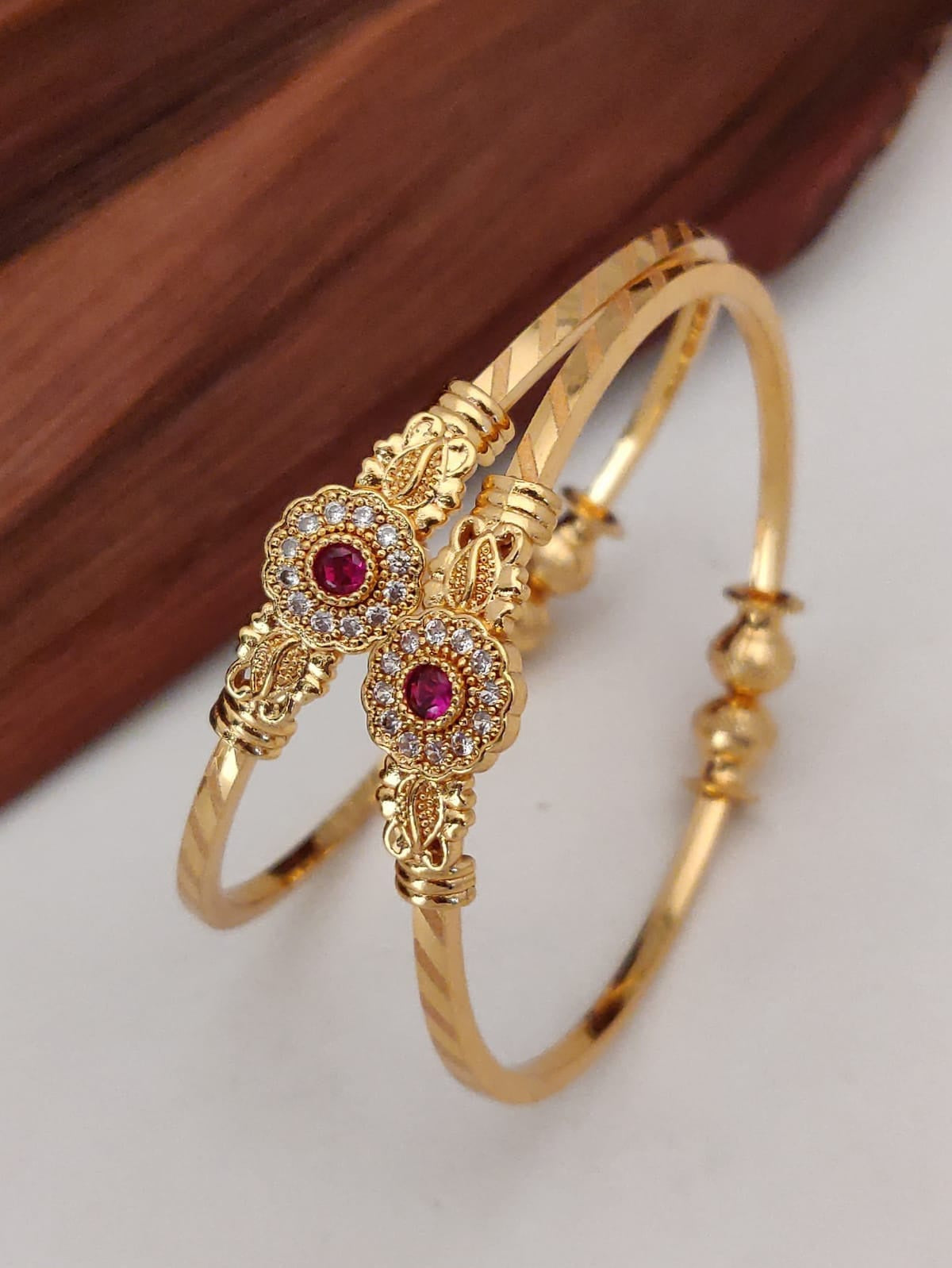 Blooming Beauty: Gold-Plated Floral Bangles with Sparkling Stones