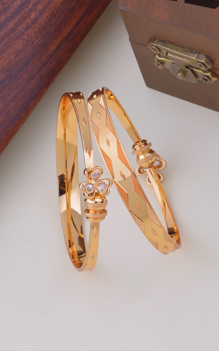 Diamond-Cut Pattern Gold Bangles with Floral Centerpiece – Elegant Ethnic Wear